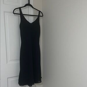Niki by Niki Livas  dress with a cowl neck and a strappy, caged back design.